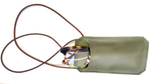 Glasses case in genuine leather with an integrated neck strap